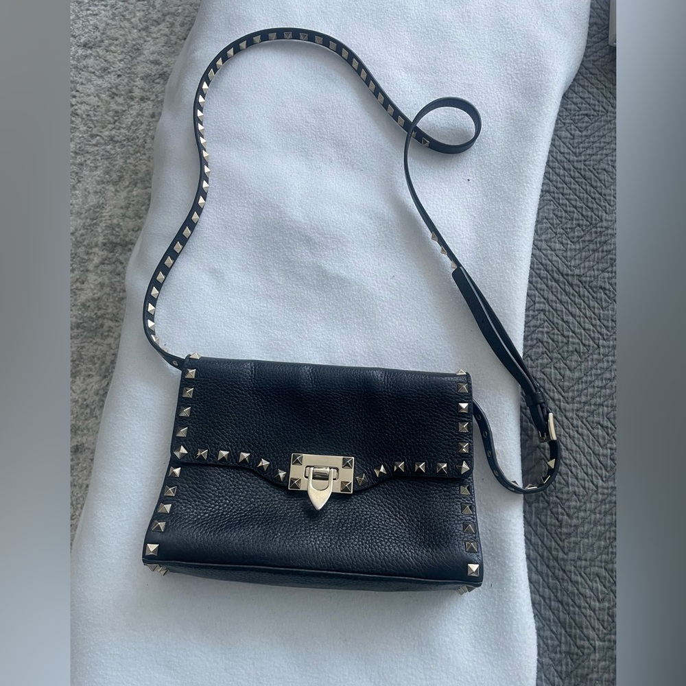 Valentino clutch with buckle and studs